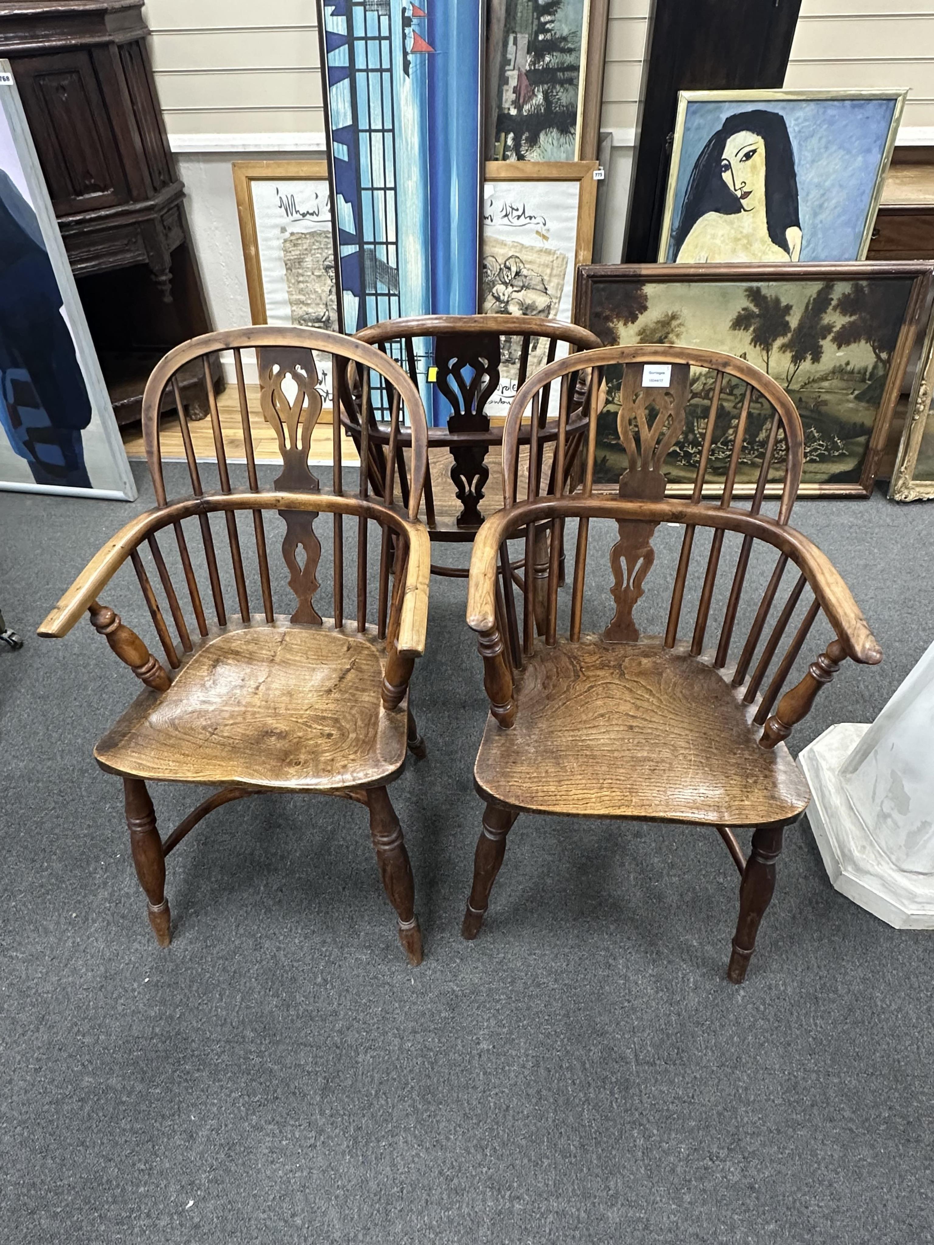 Three early 19th century Thames Valley yew and elm Windsor elbow chairs, width 53cm, depth 39cm, height 91cm. Condition - fair